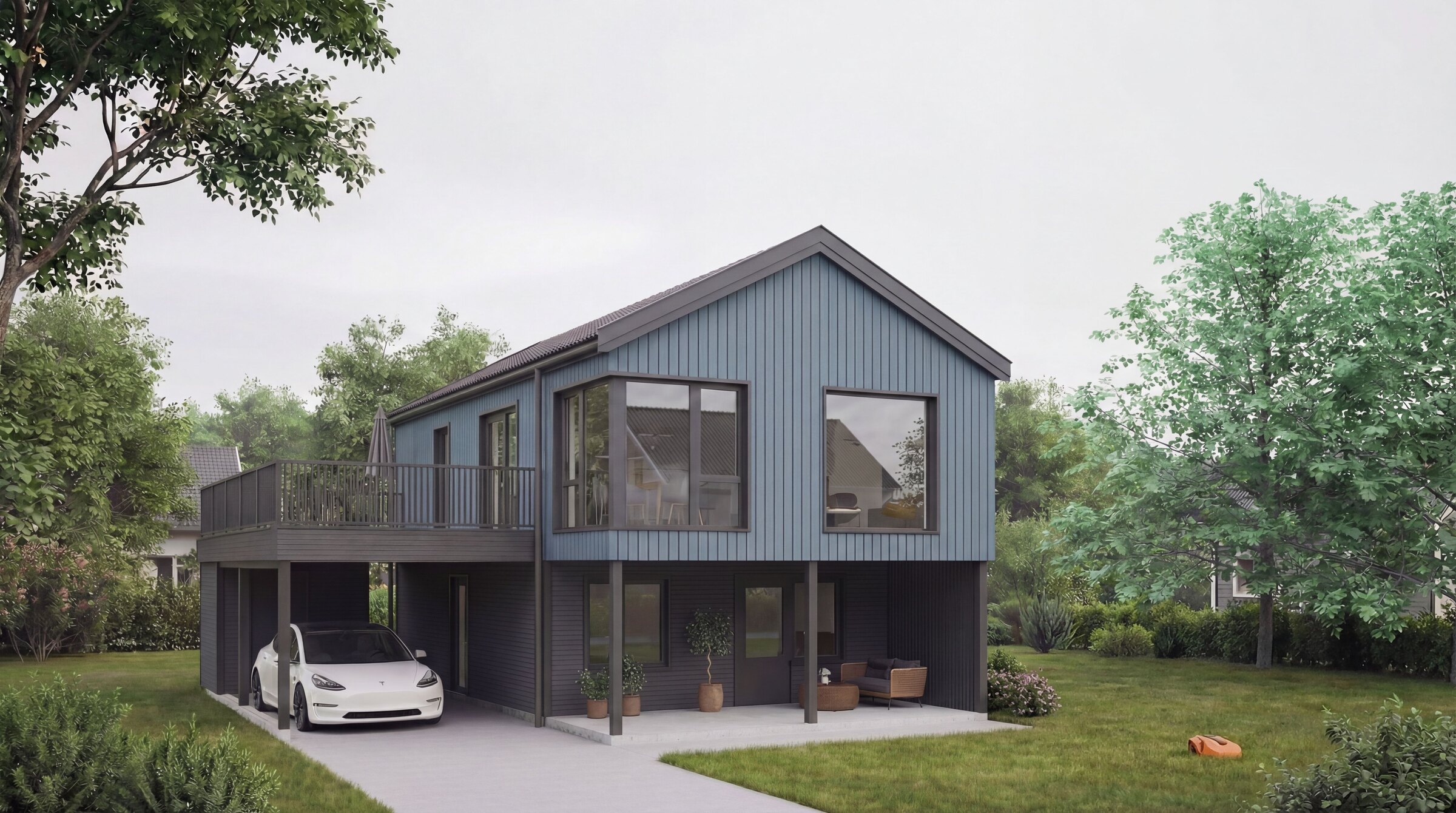 Jubileumshuset Jubel i blå kledning, med carport og terrasse over